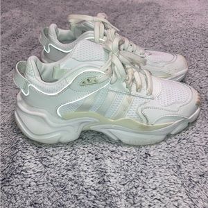 White adidas sneakers.